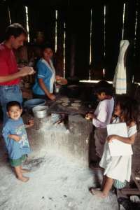 Jesse making tortillas with children watching (873.52 Kb)